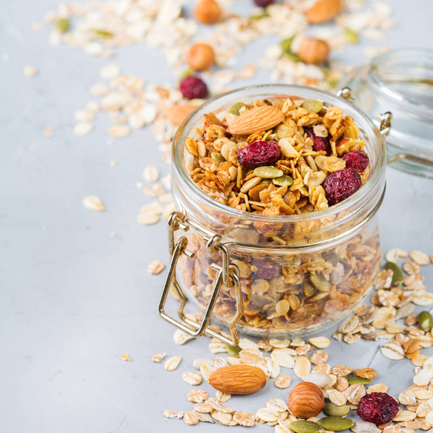 Homemade granola muesli with ingredients, healthy food for breakfast - Photo, Image
