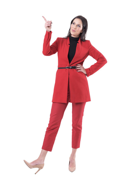 Elegant business sales woman or teacher pointing finger up showing or teaching. Full body isolated on white background. - Fotó, kép