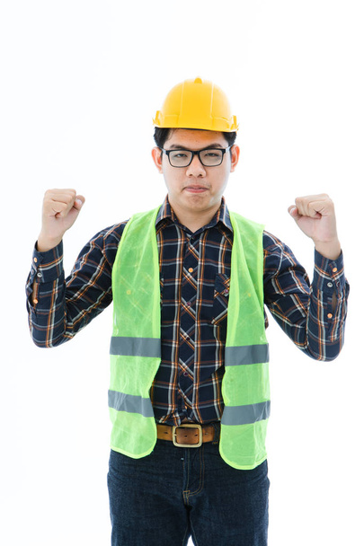 Engineer man cross arm orange helmet and vest - Photo, Image