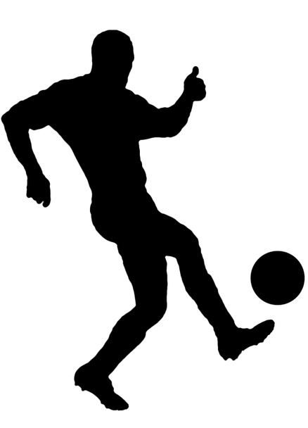 Voetbalspeler als silhouet geïsoleerd tijdens het fotograferen van een voetbal - Foto, afbeelding