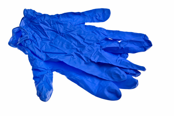donker blauwe latex handschoenen. - Foto, afbeelding