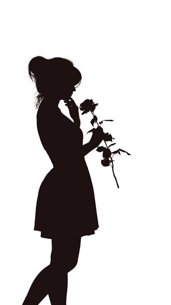 silhouette of a young elegant woman in a dress and with a rose in hands, figure of slim beautiful girl with a flower on a white isolated background - Foto, immagini