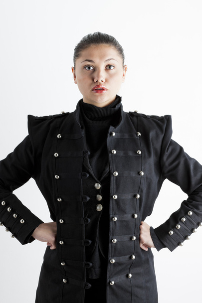 portrait of young woman wearing extravagant coat - Valokuva, kuva