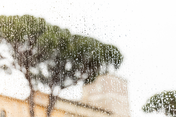 window glass with rain drops in rome, italy - Foto, Imagem