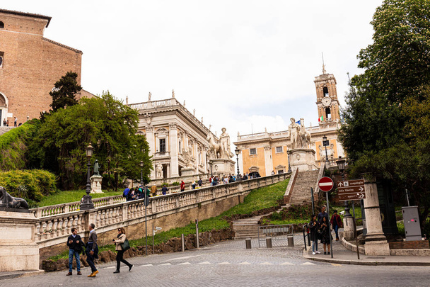 ROME, ITALY - JUNE 28, 2019: crowd of tourists walking on street  - Photo, Image