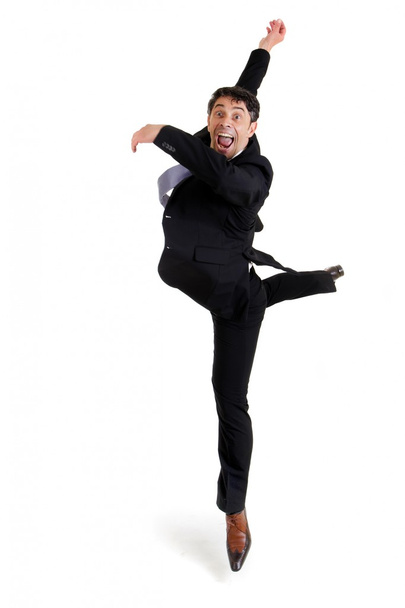 Agile zakenman doet een pirouette - Foto, afbeelding
