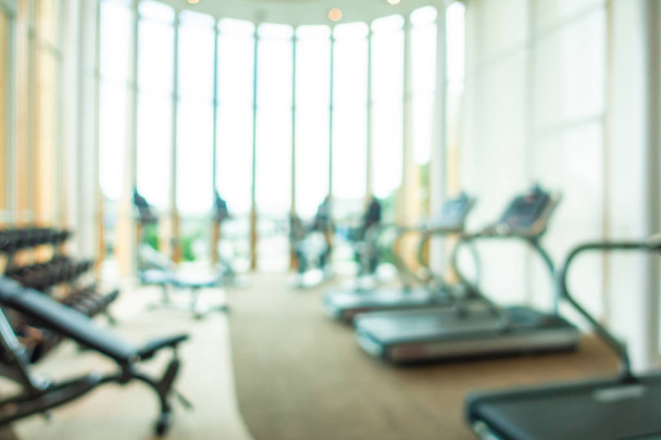 Abstract blur and defocus fitness equipment in gym room interior - Photo, image