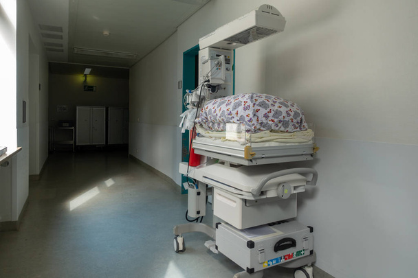 a baby incubator is standing in the corridor of a OP in a hos - Photo, Image