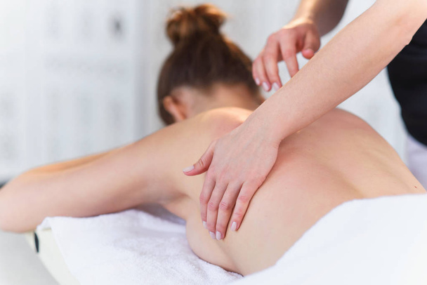 Young sport woman during treatment massage in the clinic. - Foto, Imagem
