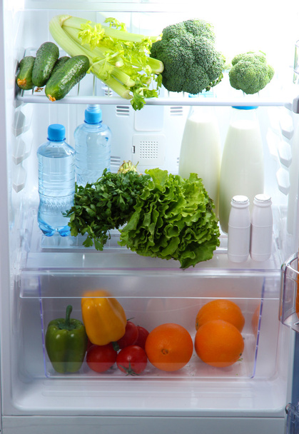 Open refrigerator with vegetarian food - 写真・画像