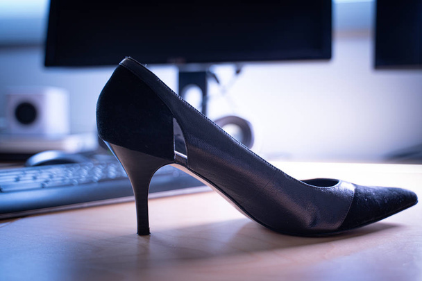 High heels on an office desk at workplace. - Photo, Image