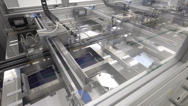 Factory produce solar cells panels. Sun battery conveyor line. Handheld motion - Footage, Video