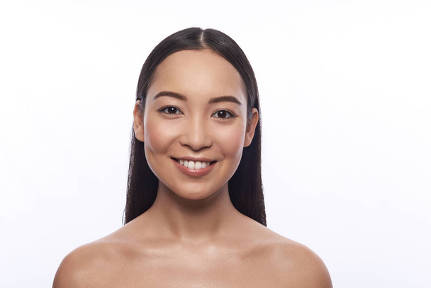 Portrait of cute Asian woman against the white background - Foto, Imagem