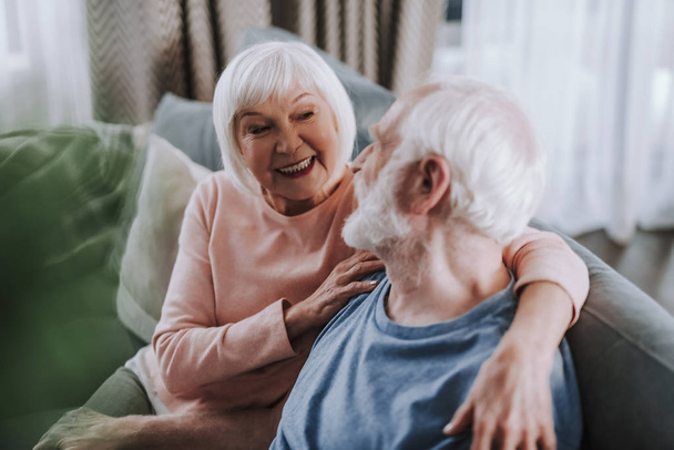 Happy aged couple enjoying being together at home - Photo, image
