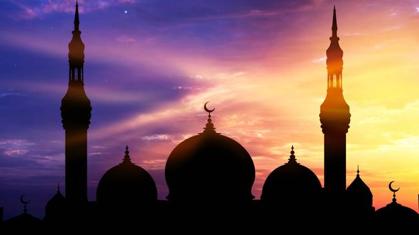 Mosque silhouette view . Generous Ramadan . An Islamic crescent on top of a mosque - 写真・画像