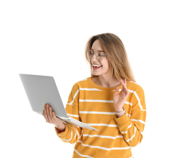 Portrait of young woman in casual outfit with laptop on white background - Foto, immagini
