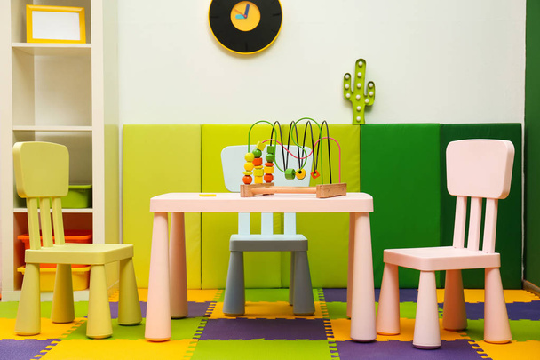 Stylish playroom interior with table and chairs - Valokuva, kuva