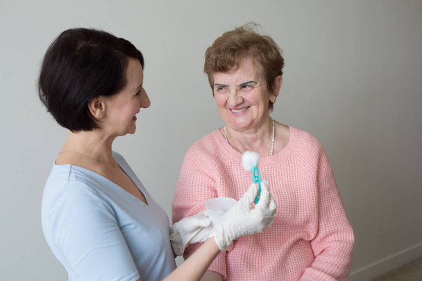 Positive  nurse medical exam retired woman - Photo, Image