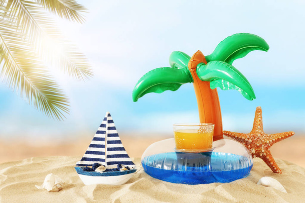 vacation and summer concept with fresh fruit drink and palm shap - Photo, Image