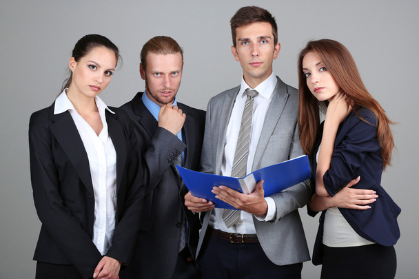 Business team on grey background - Фото, зображення