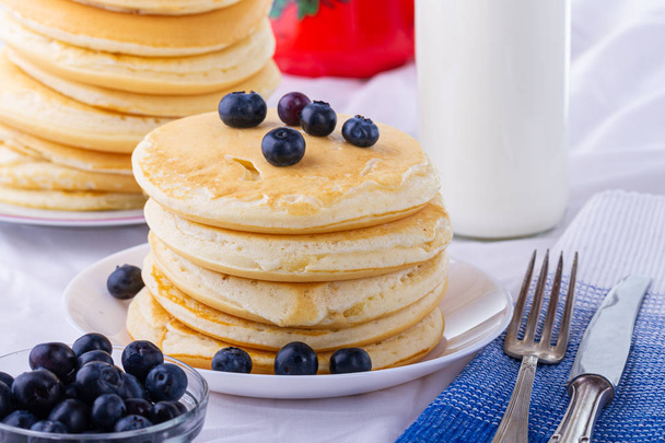 Homemade pancakes. Pancakes for breakfast, blueberries pancakes. Home breakfast. A sweet dish. Vegetarian dish.  - Photo, Image