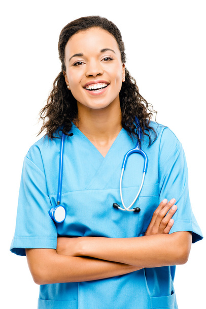 Happy mixed race nurse smiling arms folded isolated on white bac - Фото, изображение