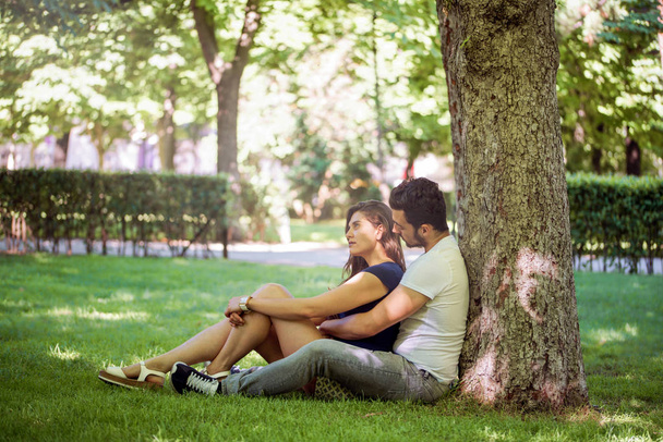 Young couple in love enjoy a sunny day in the park - Photo, image