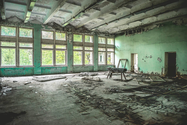 ruined school gym with sports equipment remains in Pripyat - Zdjęcie, obraz