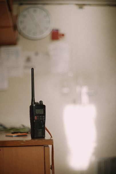 Marine VHF on the table in cabin. Copy space. Blur. Background - Photo, Image