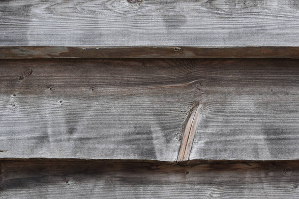 Textured wooden wall, country house close-up. front view. background of wooden planks, folded horizontally. - Foto, immagini