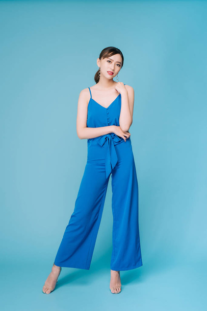Young beautiful woman posing in new casual blue fashion costume  - Photo, Image