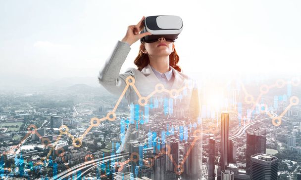 Double exposure of businesswoman wearing virtual reality glasses and modern cityscape - Fotoğraf, Görsel