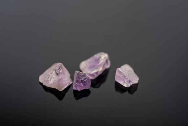 Amethyst small stones. Gems isolated on white background. - Photo, Image