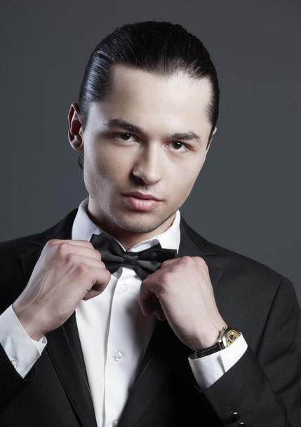 Stylish man in elegant black suit - Fotó, kép