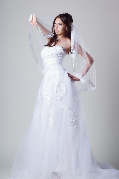 Bride in wedding dress in studio - Фото, зображення