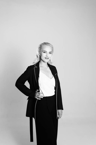 Portrait of a blond woman in a black dress - Foto, Imagem
