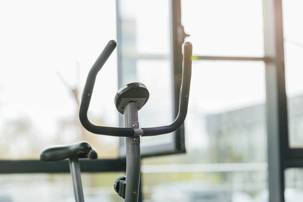 selective focus of modern elliptical machine at sports center - Photo, Image