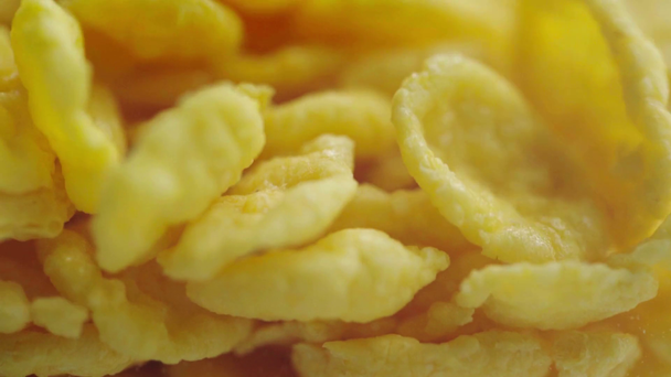 rack focus of falling tasty, sweet and crispy cornflakes  - Video, Çekim