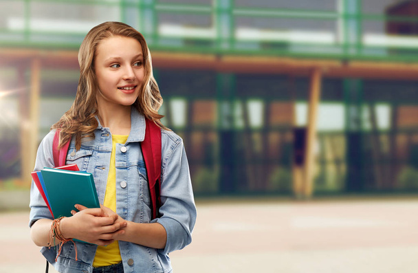 happy smiling teenage student girl with school bag - Фото, зображення