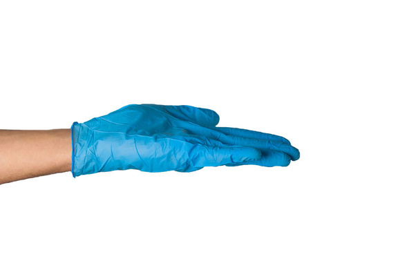 Human hand in blue rubber glove isolated on white background. Medical or cleaning concept - Foto, Bild
