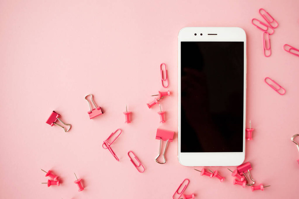 Shattered Pink Stationery, white smartphone, Pink background. Flatlay. - Foto, immagini