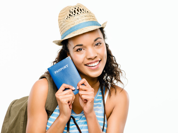 Happy African American woman tourist holding passport - Photo, image