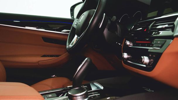 Closely shown are different parts of the car interior. Concept from: Car Garage, Glass lifts, Steering part, After dry cleaning, Absolutely new, New Generation Car. - Foto, imagen