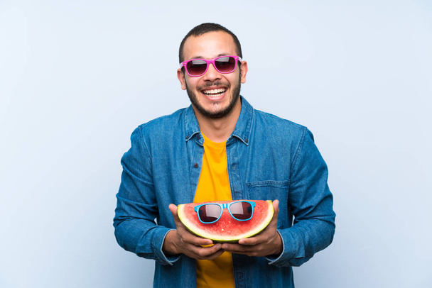 Colombian man holding a watermelon with sunglasses - Photo, Image