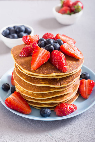Tasty pancakes with blueberry and strawberry - Fotó, kép