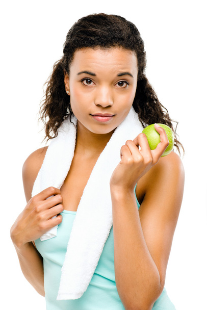 Здорова молода змішана раса жінка тримає зелене яблуко
 - Фото, зображення