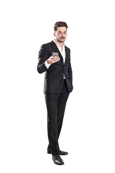 Calm bearded businessman with phone - Zdjęcie, obraz