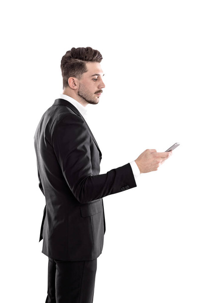 Side view of businessman using smartphone - Zdjęcie, obraz