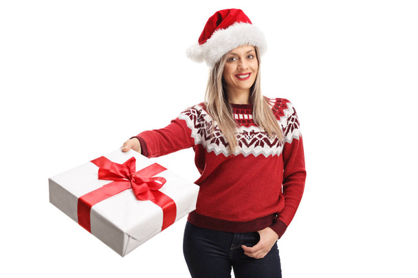 Young woman with a santa claus giving a present - Foto, imagen