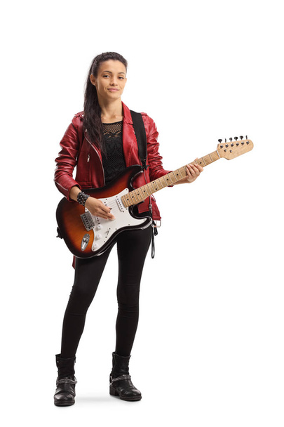 Young female with an electric guitar posing  - Фото, изображение